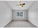 Bedroom features carpet, ceiling fan, neutral paint, and natural light, creating a tranquil retreat at 7104 Secret Rose, Douglasville, GA 30134