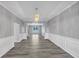 Dining room with decorative molding and modern chandelier at 7104 Secret Rose, Douglasville, GA 30134