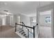 Bright hallway with staircase, neutral walls and carpet, leading to bedrooms and other living spaces at 7104 Secret Rose, Douglasville, GA 30134