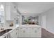 This open kitchen features white cabinets, subway tile backsplash, quartz countertops, and stainless steel appliances at 7104 Secret Rose, Douglasville, GA 30134