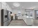 Modern kitchen with stainless steel appliances, white cabinets, and granite countertops at 7104 Secret Rose, Douglasville, GA 30134