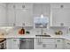 Modern kitchen with stainless steel appliances and white countertops at 7104 Secret Rose, Douglasville, GA 30134