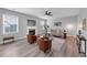 Open concept living room with fireplace, modern furniture and wood flooring, providing a comfortable space at 7104 Secret Rose, Douglasville, GA 30134