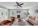 Bright living room with fireplace, modern furniture and access to the outside, offering a seamless flow at 7104 Secret Rose, Douglasville, GA 30134