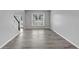 Bright living room with large window and staircase at 7104 Secret Rose, Douglasville, GA 30134