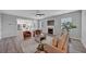 Bright living room featuring a fireplace, ceiling fan, and hardwood floors, creating an inviting atmosphere at 7104 Secret Rose, Douglasville, GA 30134