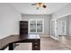 Bright office with a ceiling fan, neutral walls, and a French doors at 7104 Secret Rose, Douglasville, GA 30134
