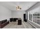 Bright office with a ceiling fan, neutral walls, and a large window for natural light at 7104 Secret Rose, Douglasville, GA 30134
