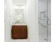 Modern bathroom featuring a glass shower with decorative tiles and a wood vanity with a marble countertop at 937 Rosedale Ne Rd, Atlanta, GA 30306