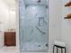 Elegant bathroom with a glass-enclosed shower featuring marble-look tile and a pebble floor at 937 Rosedale Ne Rd, Atlanta, GA 30306