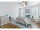 Cozy bedroom with natural light, hardwood floors, and blue accents at 937 Rosedale Ne Rd, Atlanta, GA 30306