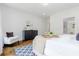Bright bedroom featuring a plush bed, stylish dresser, and a cozy sitting area with an accent chair at 937 Rosedale Ne Rd, Atlanta, GA 30306