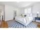 Inviting bedroom with a large bed, a geometric rug, and an ensuite bathroom with ample closet space at 937 Rosedale Ne Rd, Atlanta, GA 30306
