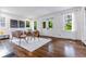 Sunlit dining room with modern chairs, fireplace and view to front yard at 937 Rosedale Ne Rd, Atlanta, GA 30306