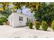 Charming white brick home with a wooden deck and green landscaping at 937 Rosedale Ne Rd, Atlanta, GA 30306