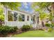 Side view of a white painted brick home with large windows offering ample natural light and curb appeal at 937 Rosedale Ne Rd, Atlanta, GA 30306