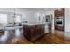 Island kitchen open to living room with stainless steel appliances and dark wood cabinetry at 937 Rosedale Ne Rd, Atlanta, GA 30306