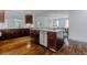 Island kitchen with stainless steel appliances, dark wood cabinetry and hardwood floors at 937 Rosedale Ne Rd, Atlanta, GA 30306