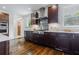 Modern kitchen with stainless steel appliances, dark wood cabinetry and tiled backsplash at 937 Rosedale Ne Rd, Atlanta, GA 30306