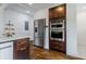 Kitchen with stainless steel refrigerator, double oven, and hardwood floors at 937 Rosedale Ne Rd, Atlanta, GA 30306