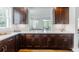Kitchen featuring dark wood cabinets, white countertops, stainless steel appliances, and ample natural light at 937 Rosedale Ne Rd, Atlanta, GA 30306