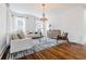 Bright and airy living room with stylish furnishings, hardwood floors, and natural light from large windows at 937 Rosedale Ne Rd, Atlanta, GA 30306