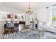 Open-concept living room flowing into a modern kitchen, featuring a breakfast bar and designer accents at 937 Rosedale Ne Rd, Atlanta, GA 30306