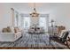 Bright and airy living room with stylish furnishings, hardwood floors, and natural light from large windows at 937 Rosedale Ne Rd, Atlanta, GA 30306