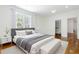 Sun-filled main bedroom featuring hardwood floors, a neutral color scheme, and a walk-in closet at 937 Rosedale Ne Rd, Atlanta, GA 30306