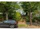 Charming white home nestled among mature trees along the street at 937 Rosedale Ne Rd, Atlanta, GA 30306