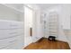 Well-organized walk-in closet featuring custom shelving, drawers, and secure storage on beautiful hardwood floors at 937 Rosedale Ne Rd, Atlanta, GA 30306