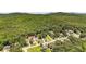 Aerial view showcasing the property nestled among lush greenery and trees in a serene neighborhood at 34 Laurel Ne Way, White, GA 30184