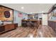 Finished basement featuring a custom-built bar and dart board for entertainment at 34 Laurel Ne Way, White, GA 30184