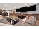 Basement with a custom entertainment center featuring three large screen televisions at 34 Laurel Ne Way, White, GA 30184