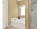 Bright bathroom featuring a soaking tub and a separate glass shower at 34 Laurel Ne Way, White, GA 30184