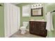 Bathroom with a tub and shower, vanity, and a window at 34 Laurel Ne Way, White, GA 30184