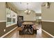 Dining room features hardwood floors, a chandelier, and built-in cabinets at 34 Laurel Ne Way, White, GA 30184