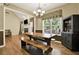 Spacious dining area with rustic table, open to the living room and kitchen at 34 Laurel Ne Way, White, GA 30184