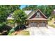 Charming home with stone accents, well-manicured landscaping, and a two-car garage at 34 Laurel Ne Way, White, GA 30184