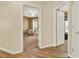 Hallway with hardwood floors leading to a bedroom at 34 Laurel Ne Way, White, GA 30184