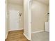 Hallway with hardwood floors leading to a laundry room at 34 Laurel Ne Way, White, GA 30184