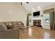 Bright living room features a stone fireplace, large windows and comfortable seating at 34 Laurel Ne Way, White, GA 30184