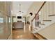 The foyer with a staircase leads to the spacious living room with a fireplace at 34 Laurel Ne Way, White, GA 30184