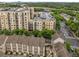 Aerial view of a mixed-use community featuring residential apartments and townhomes near a highway at 635 Broadview Ne Pl, Atlanta, GA 30324