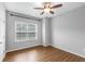 Cozy bedroom with natural light and ceiling fan at 635 Broadview Ne Pl, Atlanta, GA 30324
