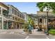 Exterior shot of retail spaces, featuring pedestrian walkways, glass-covered walkways and wrought iron, enhancing the upscale vibe at 635 Broadview Ne Pl, Atlanta, GA 30324