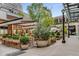 Outdoor dining space with potted plants, awnings, creating an inviting ambiance for patrons in the upscale Buckhead area at 635 Broadview Ne Pl, Atlanta, GA 30324