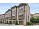 View of well-maintained townhome community with brick facades and manicured landscaping at 635 Broadview Ne Pl, Atlanta, GA 30324