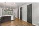 Kitchen with stainless appliances, stylish lighting, and doors leading to other rooms at 635 Broadview Ne Pl, Atlanta, GA 30324