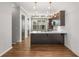 Kitchen featuring stainless appliances, stylish lighting and an island with white countertops at 635 Broadview Ne Pl, Atlanta, GA 30324